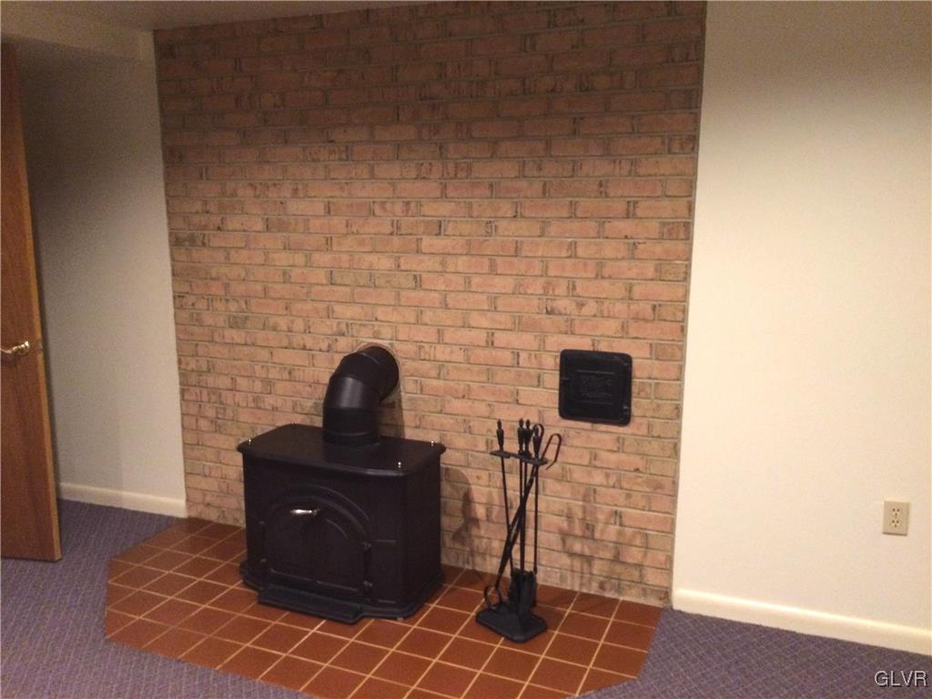 3740 Carter Road Bethlehem, PA 18020 - Photo 32 of 44 Basement family room and stove