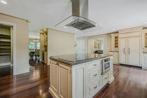 a kitchen with stainless steel appliances granite countertop a stove and a refrigerator
