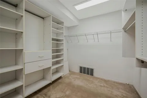 a view of an empty walk in closet