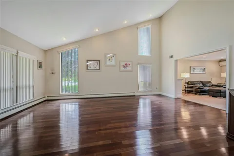 a view of a livingroom with wooden floor