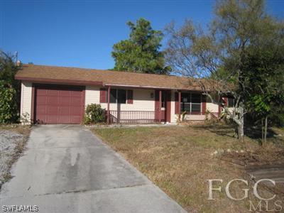 17440 Kentucky Road Fort Myers, FL 33967 - Photo 1 of 6 front view of a house with a yard