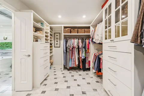 a workspace with furniture and a large window