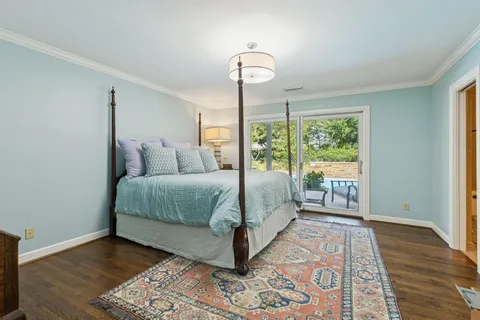 a en suite bathroom with a granite countertop sink and a mirror