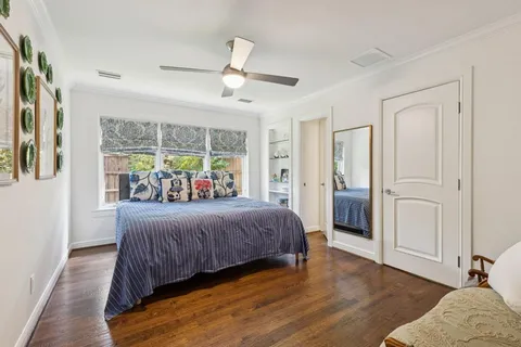 a bathroom with a granite countertop sink a mirror and a bathtub