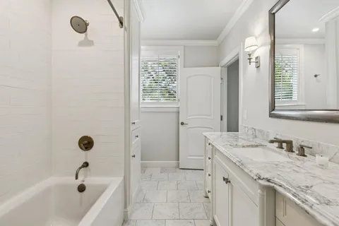 a bed room with a bed and a large window