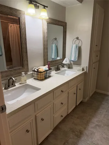 a bath tub sitting next to a white sink