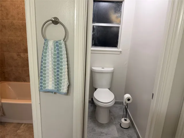 a spacious bathroom with a double vanity sink and a mirror