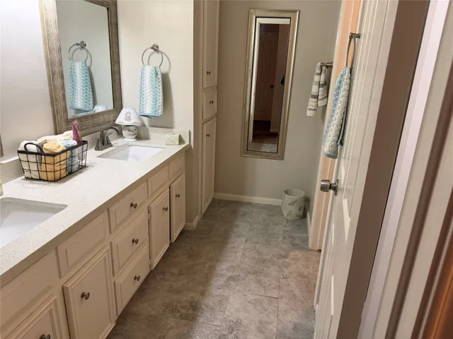 a view of a livingroom with furniture and an empty room