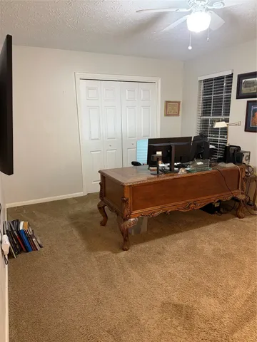 a bedroom with furniture and window