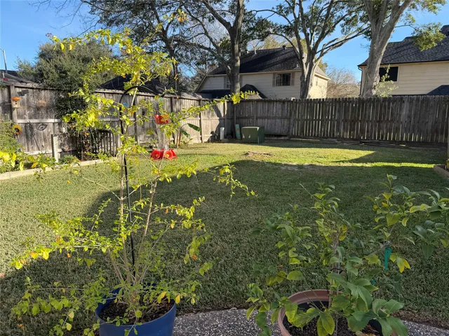 a view of yard with swimming pool