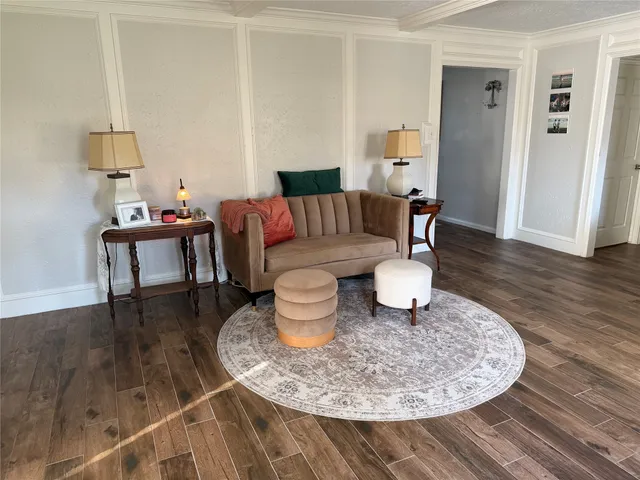 a living room with furniture and a table