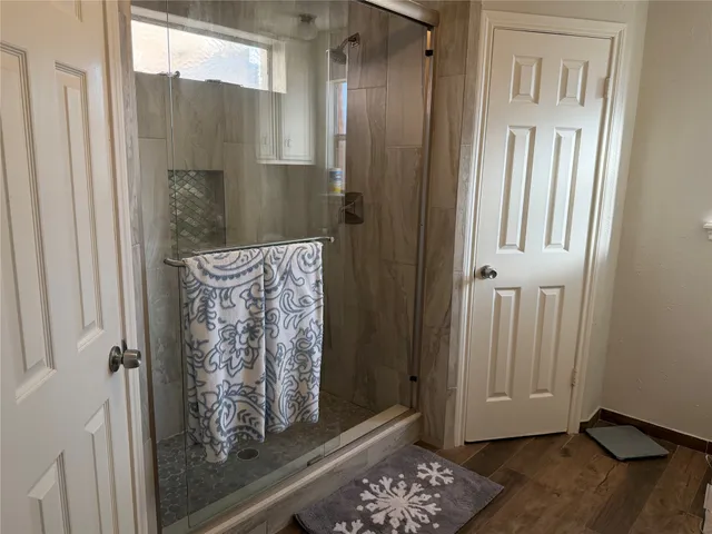 a view of front door with wooden floor