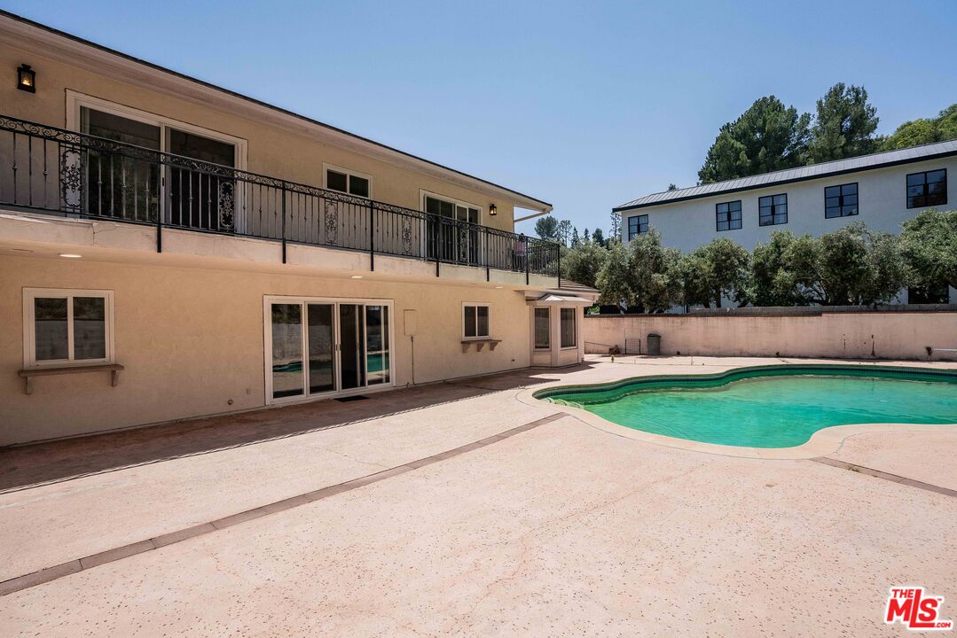 1181 Somera Road Los Angeles, CA 90077 - Photo 32 of 40 a view of a house with a yard