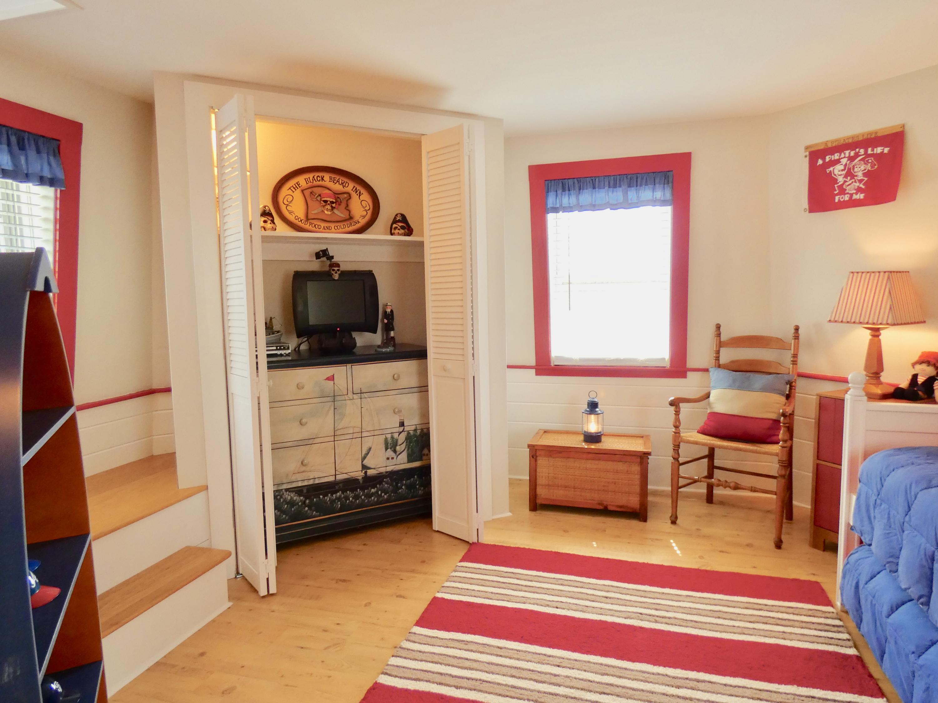 16 Soundview Road Harwich, MA 02645 - Photo 24 of 46 a bedroom with furniture and a gate