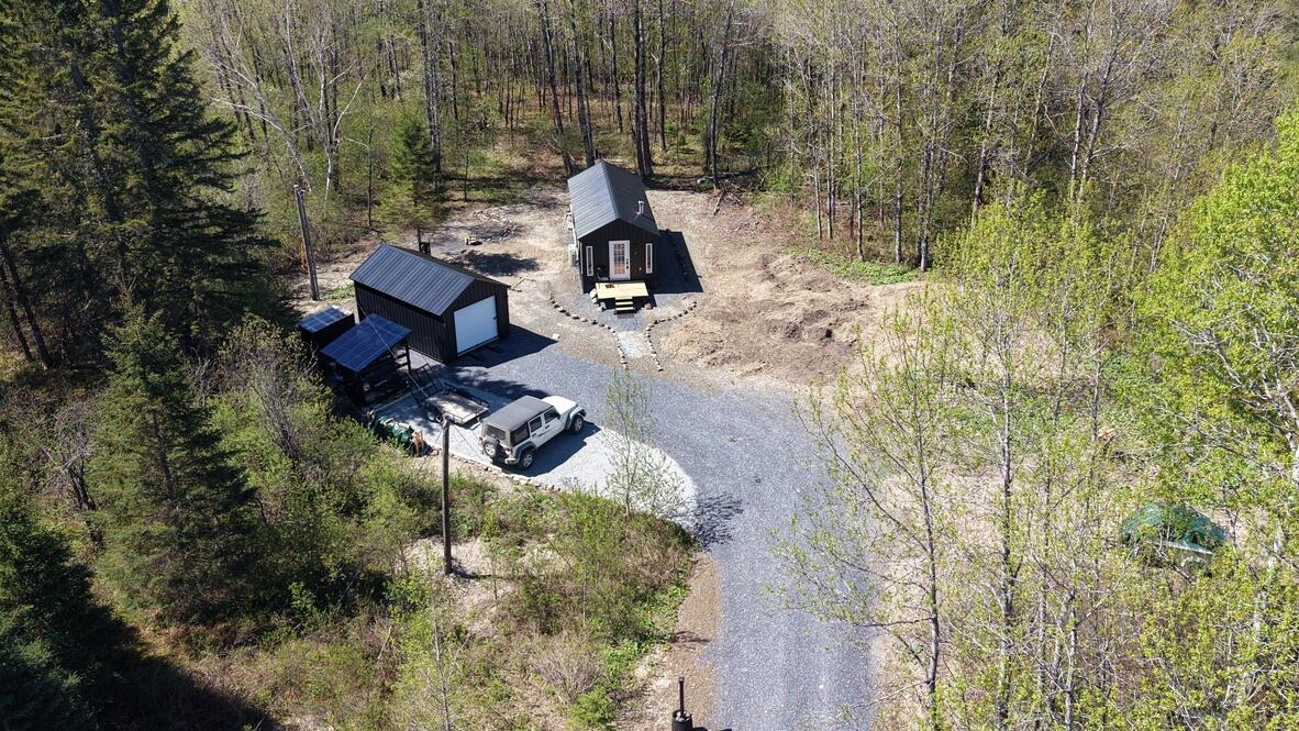 345 McIntyre Road Woodland, ME 04736 - Photo 1 of 28 Cabin nestled in woods