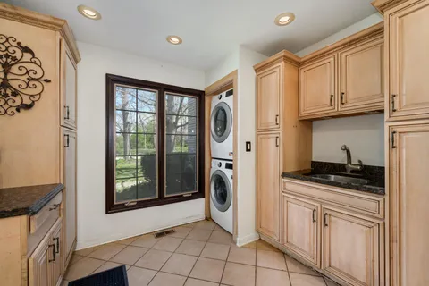 a kitchen with stainless steel appliances granite countertop a stove a refrigerator and a microwave