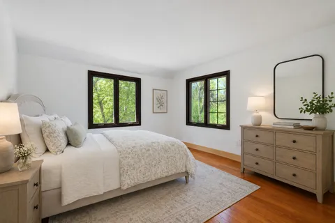 a bedroom with a bed and a dresser