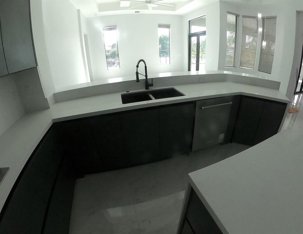 11000 Southwest 30th Court Fort Lauderdale, FL 33328 - Photo 19 of 44 a kitchen with a sink and a mirror