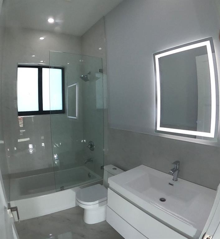 11000 Southwest 30th Court Fort Lauderdale, FL 33328 - Photo 34 of 44 a bathroom with a sink a toilet and shower