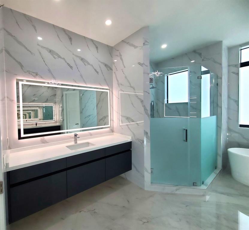 11000 Southwest 30th Court Fort Lauderdale, FL 33328 - Photo 7 of 44 a bathroom with a sink and mirror