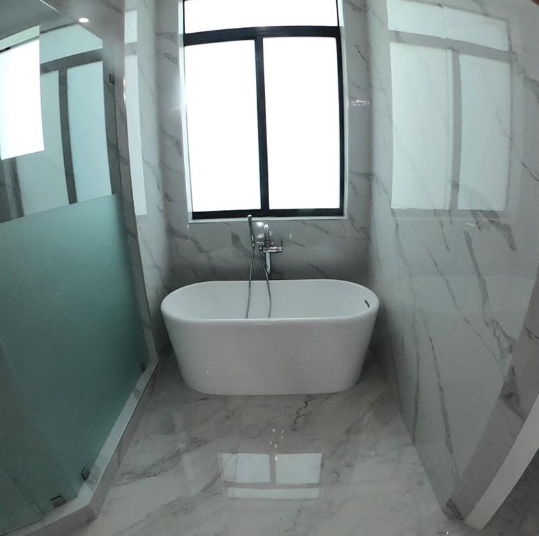 11000 Southwest 30th Court Fort Lauderdale, FL 33328 - Photo 10 of 44 a bath tub sitting in a bathroom next to a window