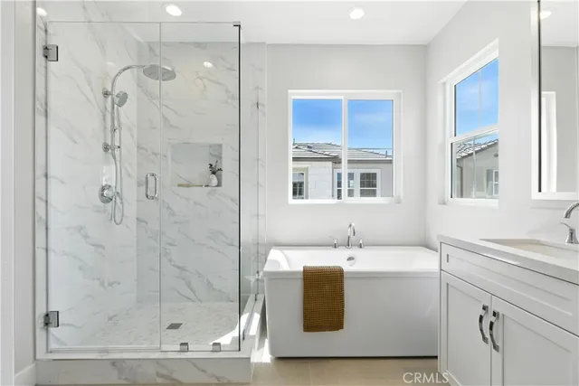 a bathroom with a sink a mirror and a shower