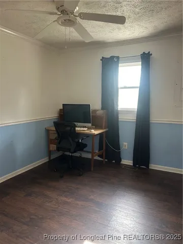 a workspace with furniture and a window
