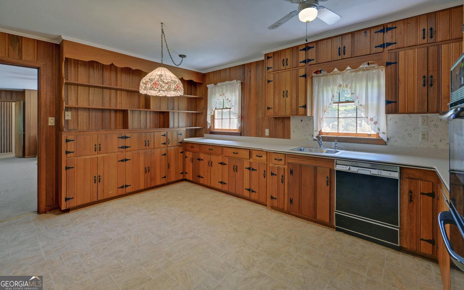 400 Harris Street Toccoa, GA 30577 - Photo 9 of 49 a kitchen with cabinets and window