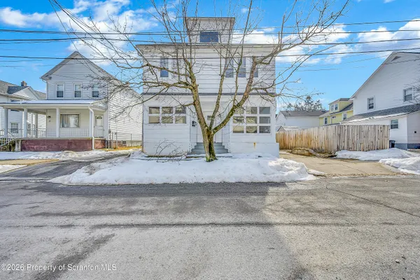 a view of a building with a yard