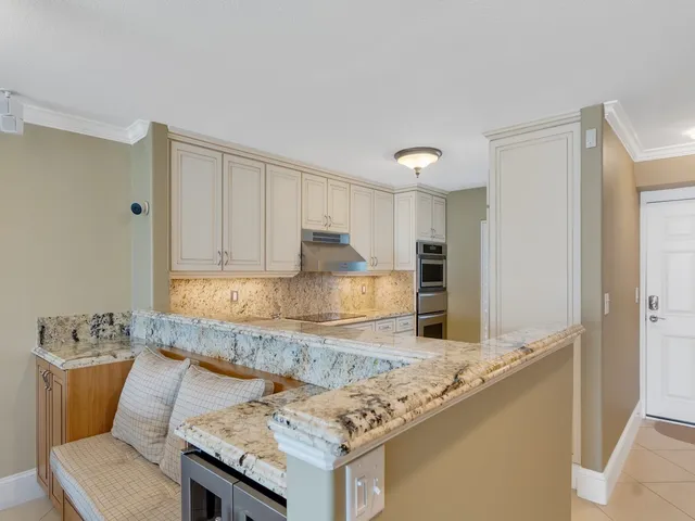 a kitchen with sink and cabinets