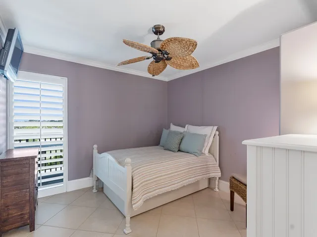a bathroom with a granite countertop sink a toilet a mirror and shower