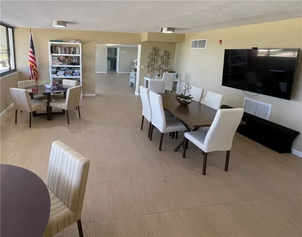 a living room with furniture and a lamp