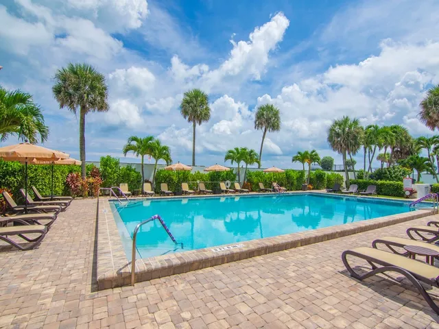 a view of a backyard with sitting area and furniture