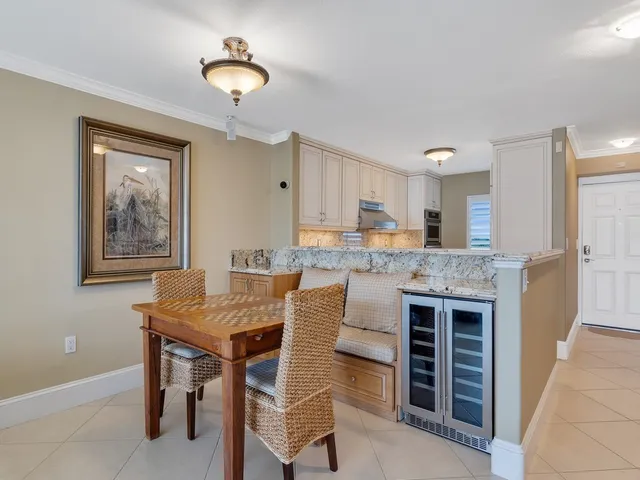 a kitchen that has a table and chairs in it