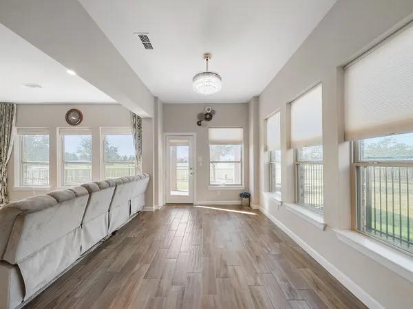 a utility room with cabinets washer and dryer