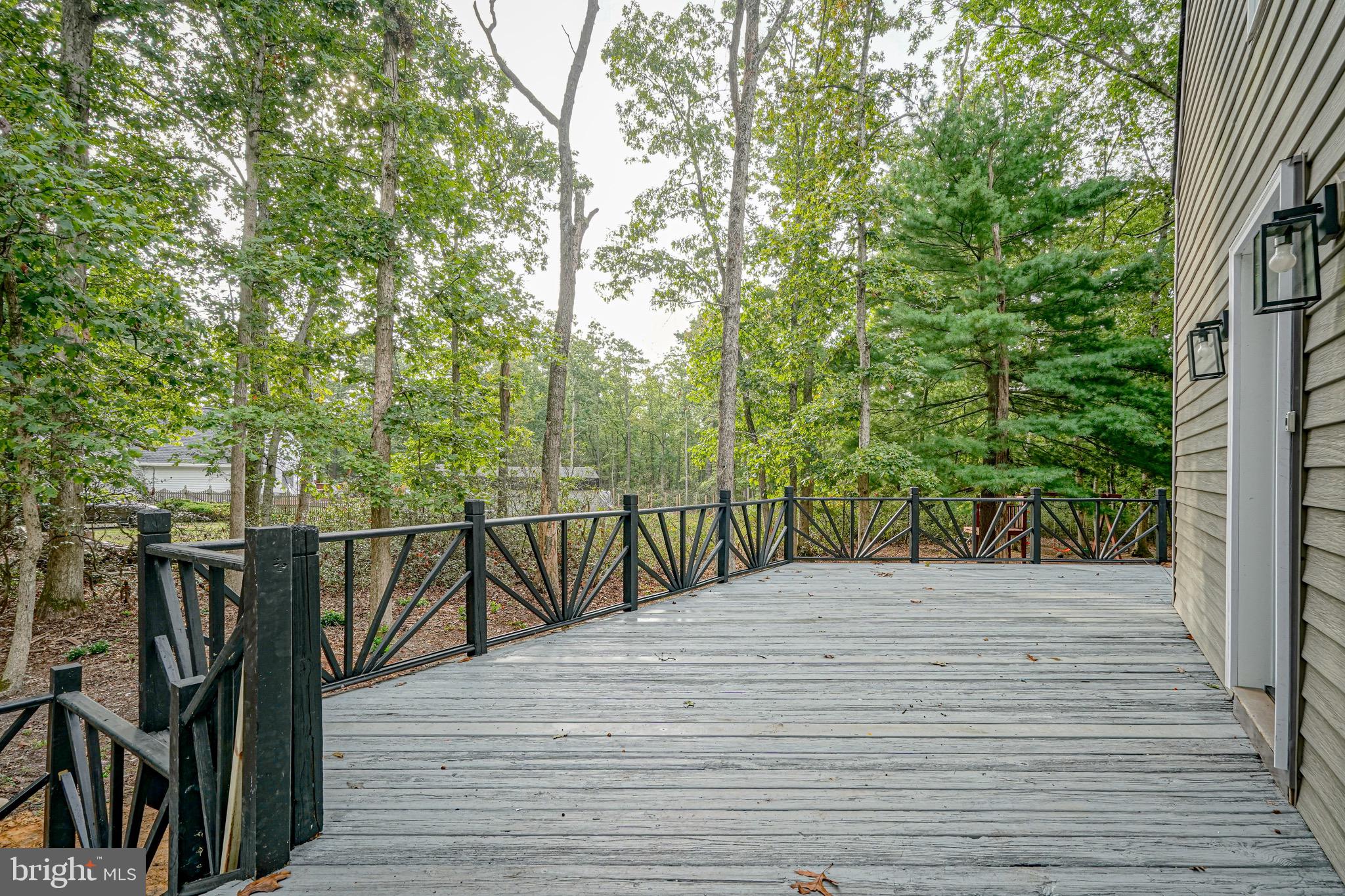965 Martha Boulevard Atco, NJ 08004 - Photo 57 of 70 a view of balcony with wooden floor and fence