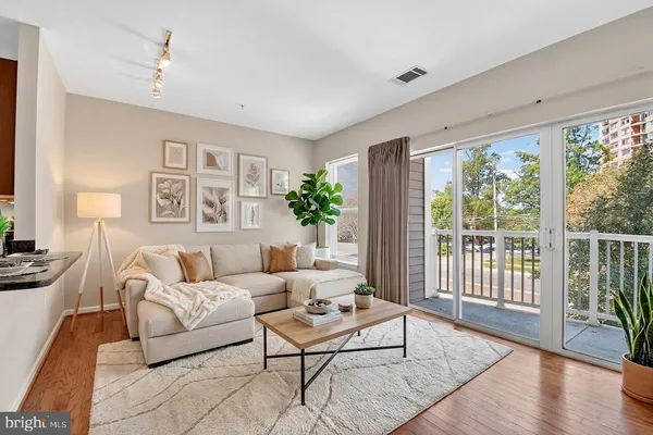 a kitchen with stainless steel appliances granite countertop a sink stove and microwave