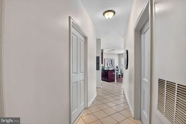 a view of a hallway with washer and dryer