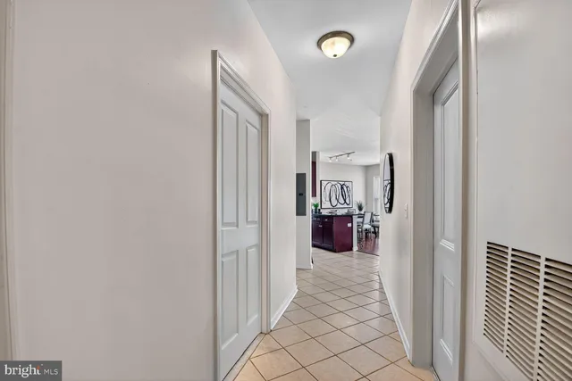 a view of a hallway with washer and dryer