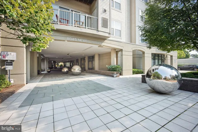 a view of a patio with table and chairs and potted plants