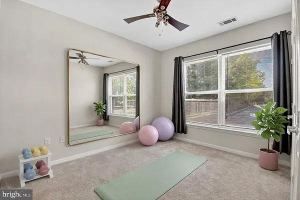 a view of a chairs and table in the patio