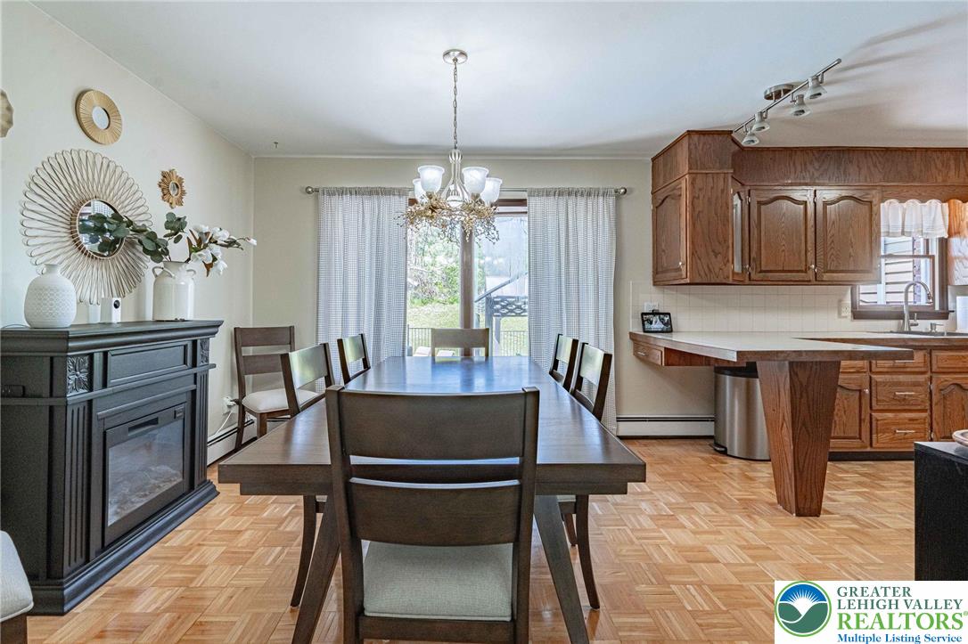 3857 Friedens Road Slatington, PA 18080 - Photo 31 of 75 This inviting space combines dining and kitchen, offering comfortable living and ample entertaining possibilities.