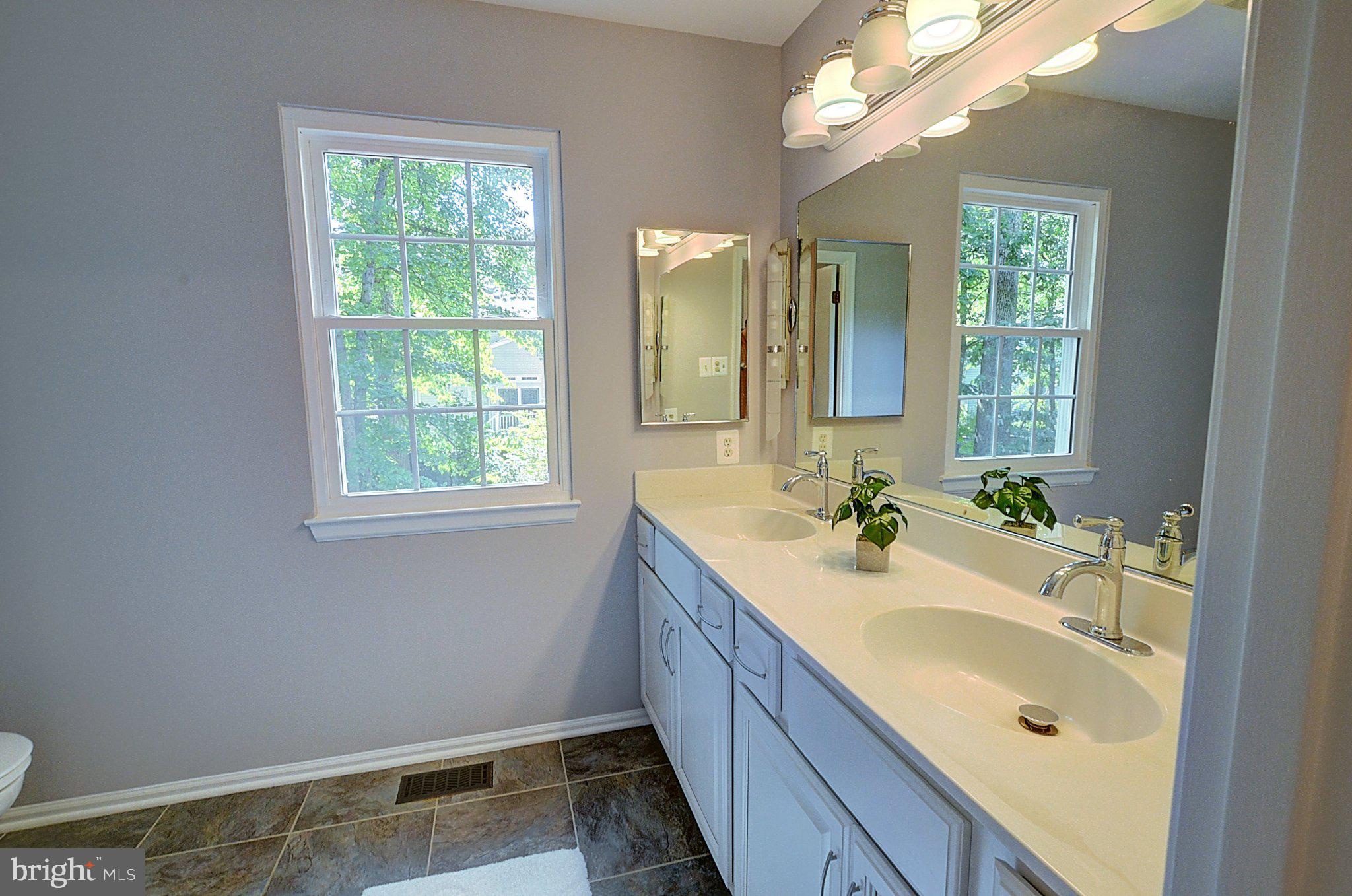 10971 Hickory Ridge Road Columbia, MD 21044 - Photo 16 of 31 Primary Bath With Double Sinks And Tile Floors