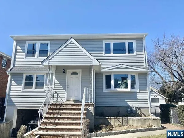 a view of a house with a balcony and door