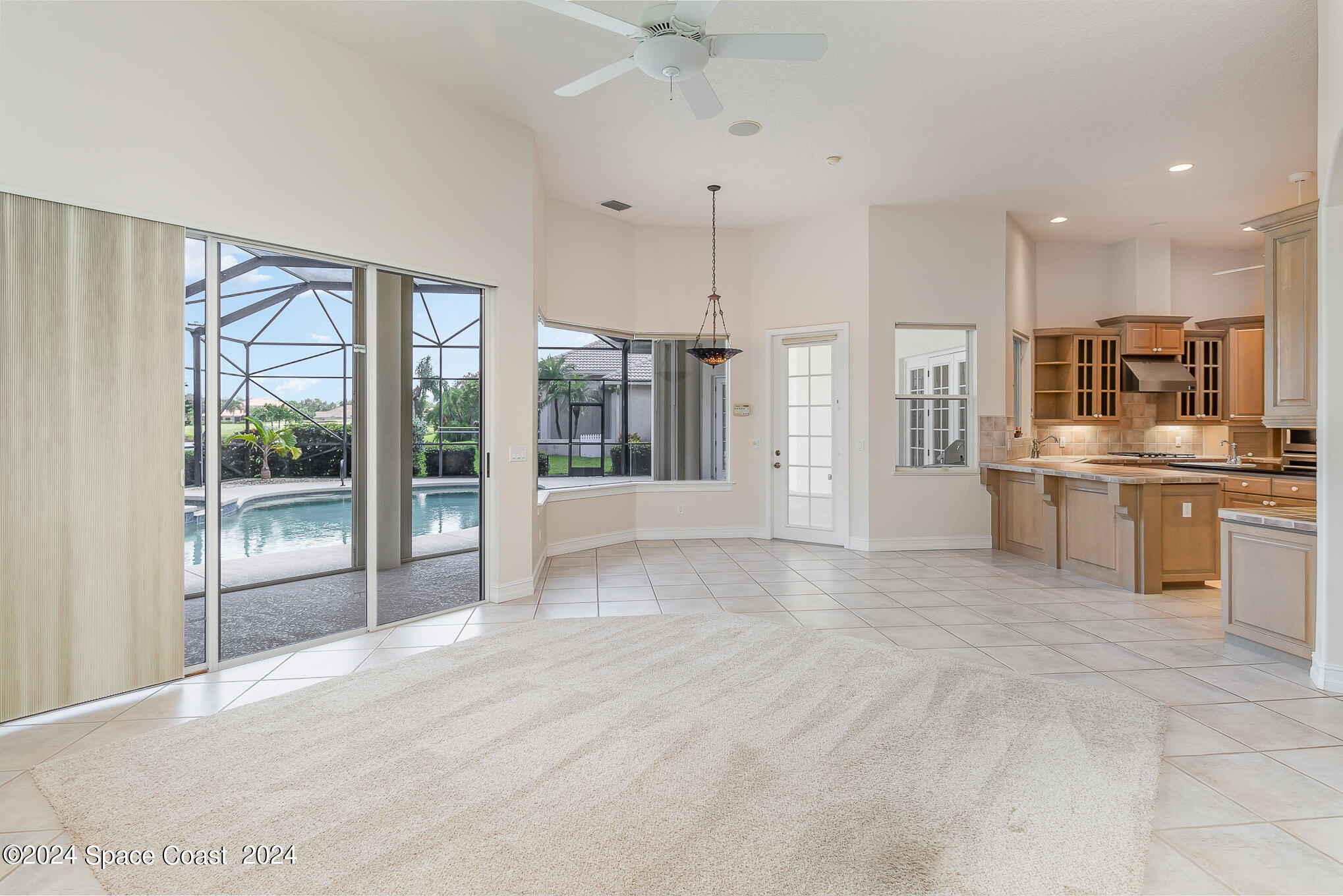 465 Baytree Drive Melbourne, FL 32940 - Photo 11 of 36 a large white kitchen with a large window