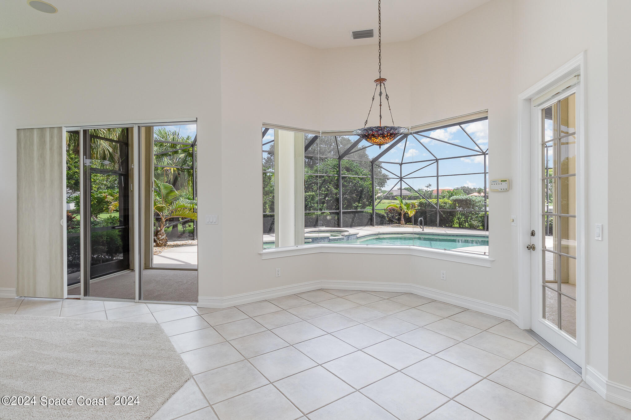 465 Baytree Drive Melbourne, FL 32940 - Photo 12 of 36 a view of an empty room with a window