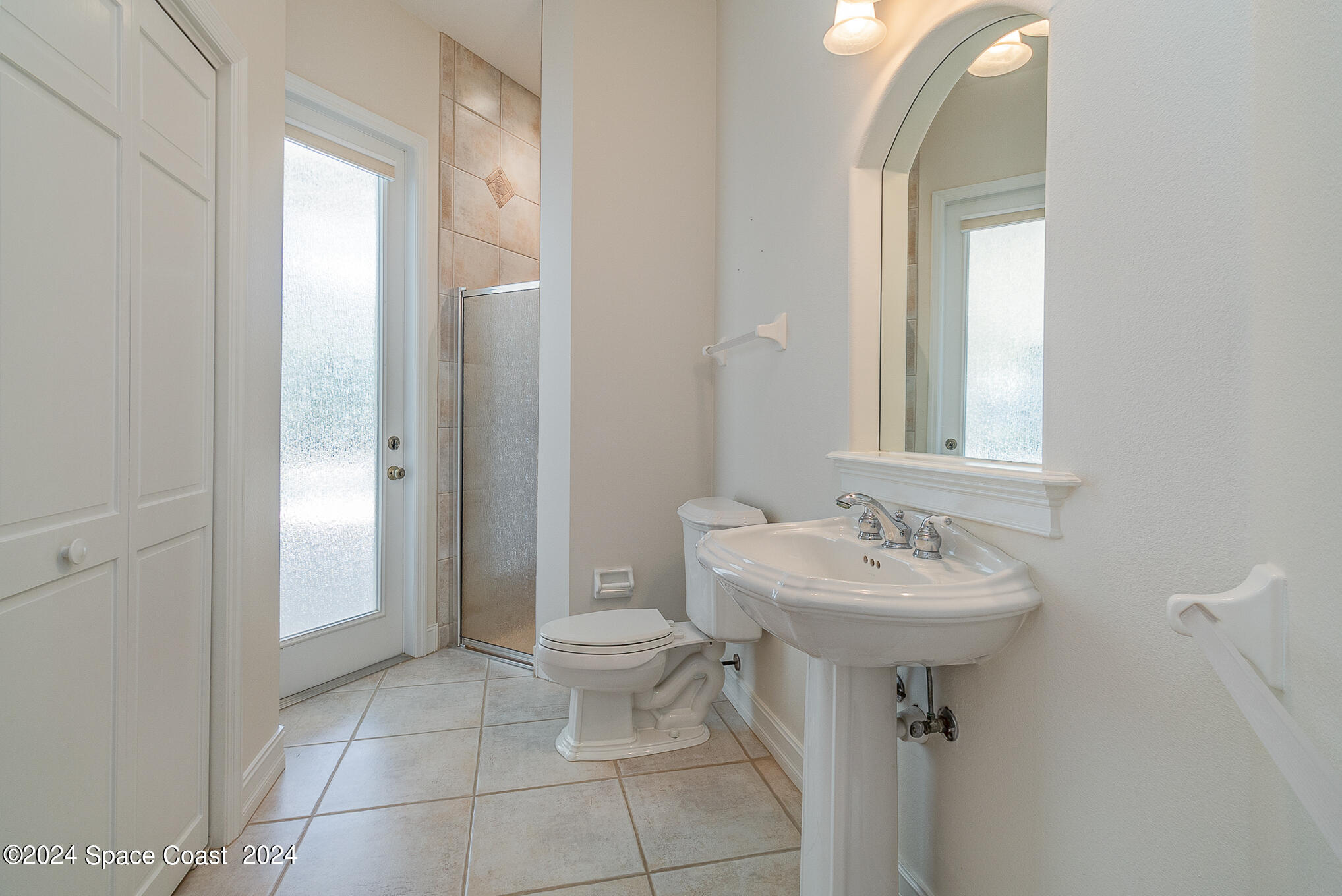 465 Baytree Drive Melbourne, FL 32940 - Photo 16 of 36 a bathroom with a sink toilet and shower