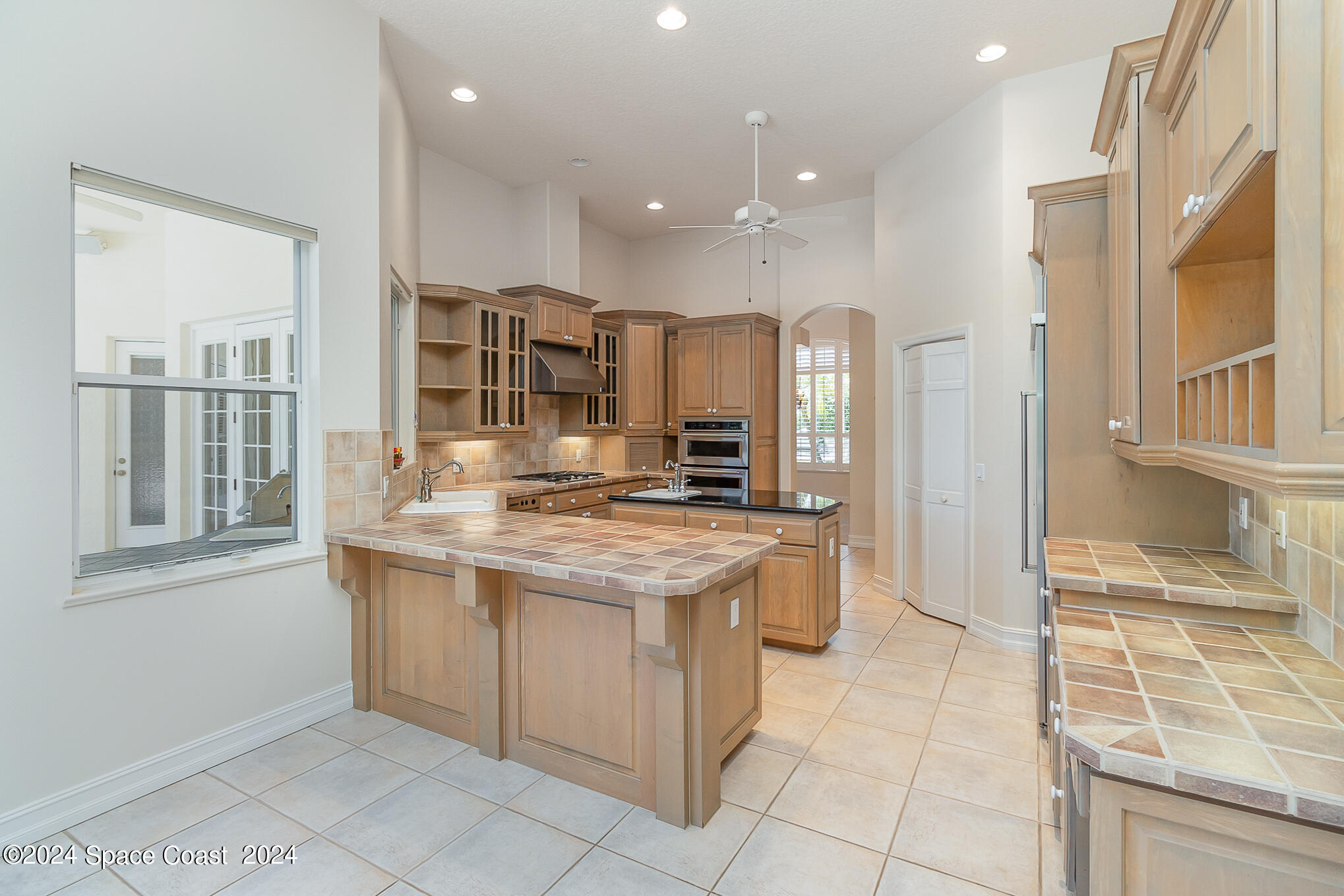 465 Baytree Drive Melbourne, FL 32940 - Photo 5 of 36 a kitchen with stainless steel appliances granite countertop a stove and a refrigerator