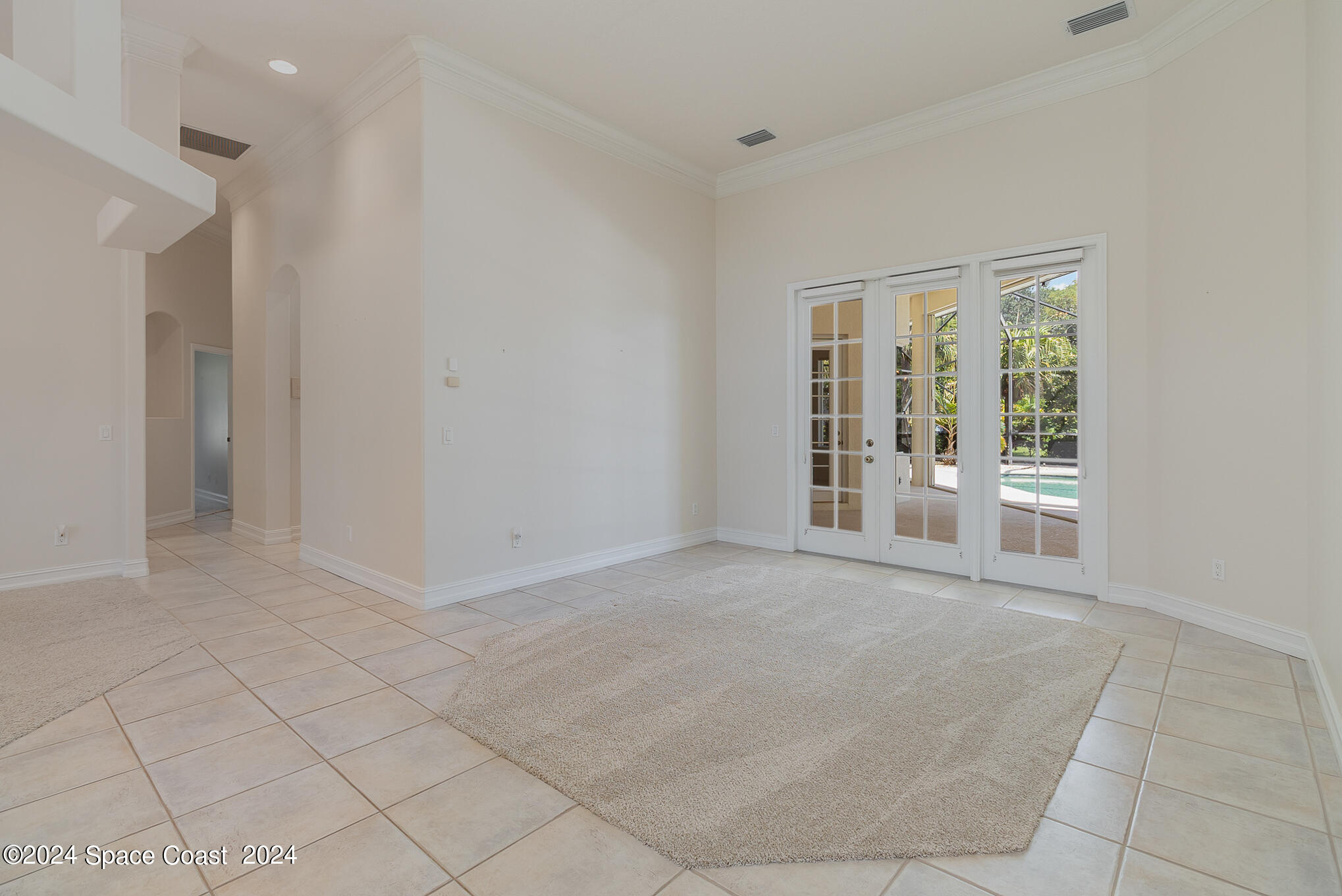 465 Baytree Drive Melbourne, FL 32940 - Photo 6 of 36 a view of an empty room with a window