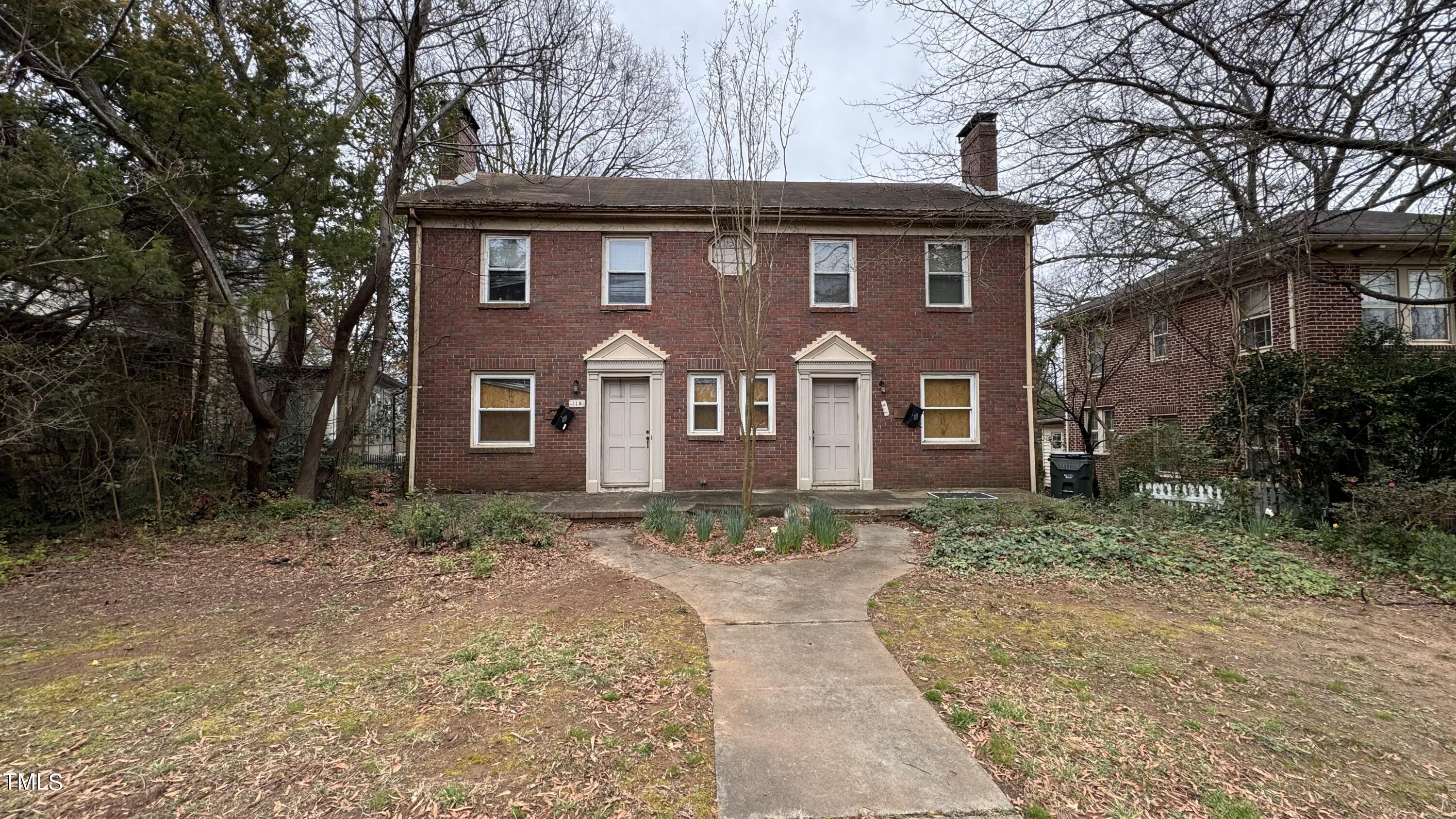 116 Horne Street Raleigh, NC 27607 - Photo 1 of 16 a front view of a house with a yard